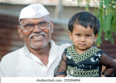 Indian Rural Baby Girl With Grand Father Closeup Salunkwadi, Ambajaogai, Beed, Maharashtra, India, South East Asia