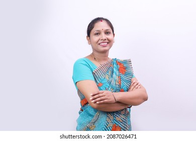 Indian rural happy villager woman standing in saree on a white background.