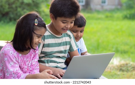 Indian Rural Kids Learning Online On Laptop