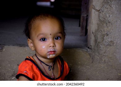 Indian Rural Mother Feeding Her 10 Months Baby Girl With Spoon, First Solid Food For Kid, Selective Focus