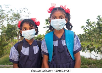 Indian Rural Schoolgirls In Face Masks And Uniforms At School During Covid-19