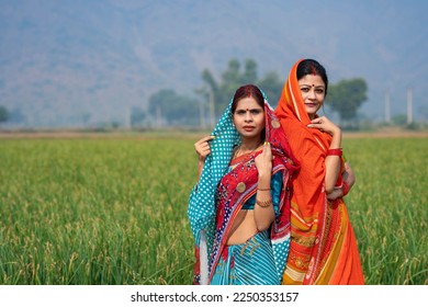 Indian rural woman’s in traditional saree at agriculture field. - Shutterstock ID 2250353157