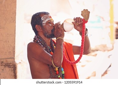 Indian Sadhu Blowing The Conch