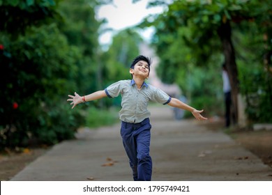 Indian School Boy Running At Playground