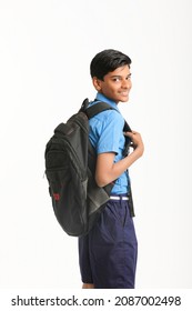 Indian School Boy Standing On White Background.