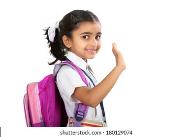 Indian School Girl  Saying Good Bye And Waving To Her Hand.Isolated On White Background.