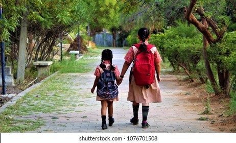 Indian School Girls Hanging Out.
Children Of All Ages From Pre-K To Teens Picking Out An Outfit At Home