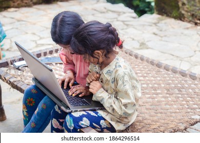 Indian School Kids Girl Watching Online Education Classes At Home. COVID-19 Pandemic Forces Children Online Learning.