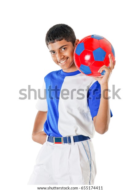 Indian Schoolboy Playing Football Isolated On Stock Image