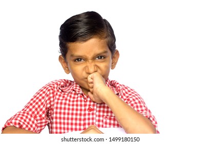 An Indian  Schoolboy  Scrunching His Nose