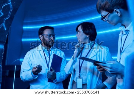 indian scientist talking to team while working on invention in innovation hub