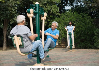 Indian Senior Males Enjoying The Exercises At Park