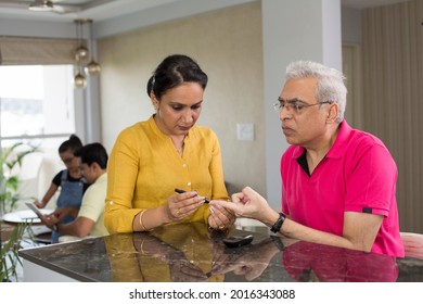 Indian Senior Man And Him Daughter Test Diabetes Check By Them Self In They Home.