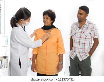 Indian Senior Medical Checkup With An Asian Female Doctor