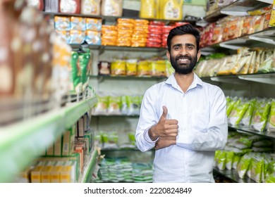 Indian shop keeper in Grocery store showing thumbs up