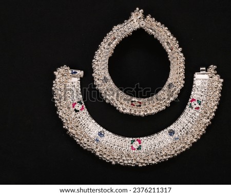 Indian Silver Anklets Jewellery Isolated On Black Background.