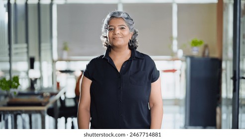 Indian smiling happy middle aged business woman look camera do pose for head shot portrait video at workplace. Elder old gen x cute female worker staff standing proud confident indoor job office place - Powered by Shutterstock