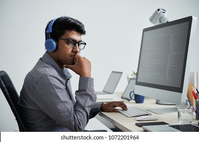 Indian Software Developer Thinking How He Can Improve His Code