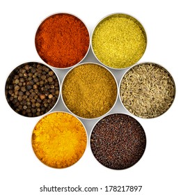 Indian spices in little stainless-steel bowls.