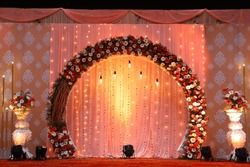 Indian Stage Decoration With Multi Color Flowers, Props And Lights. Wedding Stage Decoration Yellow Theme, With Flower Theme Arch Decor