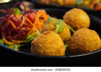 Indian Starter Snack Fried Cottage Cheese Paneer Potato Corn Balls Served On Platter With Carrot Beet Coriander Salad