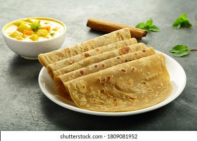 Indian Street  Foods- Whole Wheat Chapati Or Chapathi With Vegetable Curry.