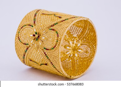 Indian Style Beautiful Floral Gold Bangle Isolated On White Background. Gold Jewellery Stock Photo.