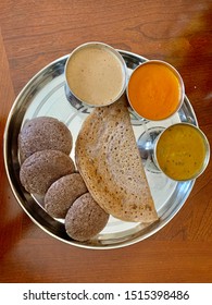 Indian Style Healthy Breakfast Ragi Idli Dosa Pancakes With Peanut, Tomato Chutney And Sambhar Lentil Soup