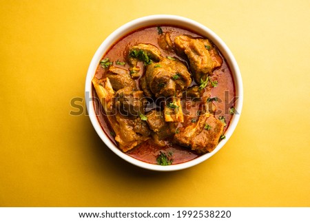 Indian style meat dish or Mutton OR Gosht Masala OR lamb rogan josh served in a bowl, selective focus