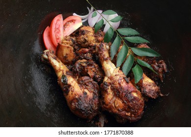 Indian style spicy fried chicken in a frying pan - Shutterstock ID 1771870388