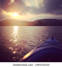 Indian Summer. Single Kayak On Rose Valley Lake In Trout Run, Pennsylvania Observing The Sunset.