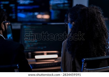 Indian technical lead explaining complex code structures and AI model inference parameters to a Brazilian colleague during a programming sprint.