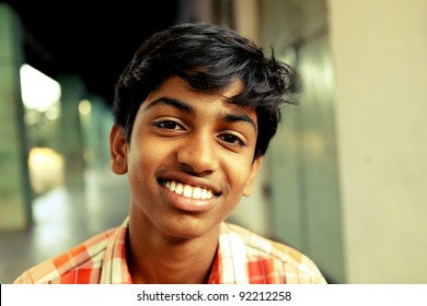 Indian Teen Boy Looking At The Camera.