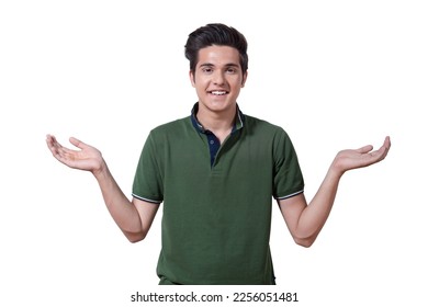 Indian teen boy throwing up hands isolated on white background. Half-length portrait of smart teen boy in a green t-shirt throwing up hands looking at camera isolated on white background - Shutterstock ID 2256051481