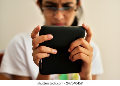 Indian Teenage Girl Using Whatsapp Or Chatting On Her Mobile Phone. International Women’s Day. Mobile Phone Cover For Protection.