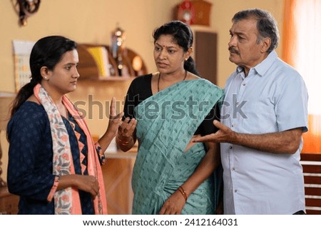 Indian teenager daughter arguing or fighting with parents at home - concept of family misunderstanding, conflict conversation and generation problems.