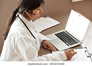 Indian Telemedicine Doctor Wear Headset Consulting Patient By Online Video Call. Female Gp Communicating With Client In Remote Telehealth Conference Video Chat In India. Virtual Visit In Zoom Meeting.