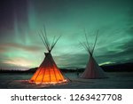 Indian Tipies under the northern lights in Whitehorse, Yukon (Canada)