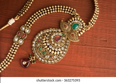 Indian traditional jewellery over wooden background, Selective focus