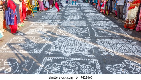 Indian traditional kolam (known in tamil language) or rangoli is drawn using white colored rice, during festival season 0256980 chennai india tamil nadu mylapore