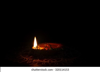 Indian Traditional Kolam With Oil Lamp