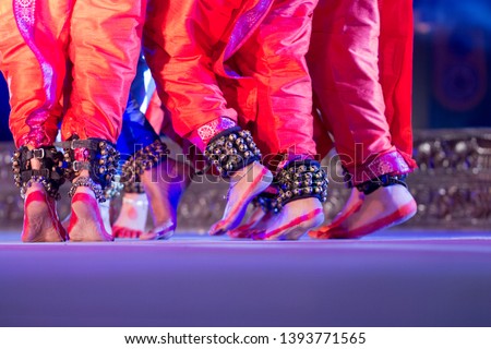 Indian Traditional odissi dancers feets with Traditional ankle bells called ghungroo, Alta