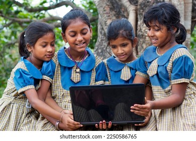 indian village government school girls operating laptop computer system at rural area in india - Shutterstock ID 2250586765
