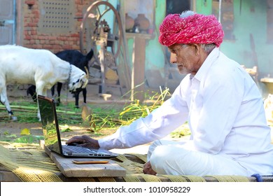 indian-villager-works-on-laptop-260nw-10