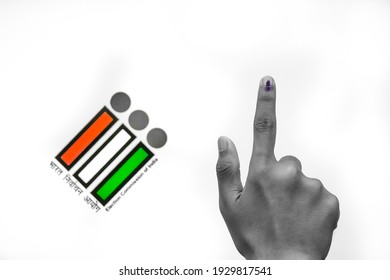 Indian Voter Hand with voting sign and ink pointing vote for India behind on election commission of India background.