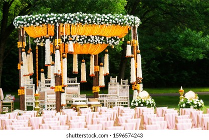 Indian wedding mandap decor yellow and white flowers