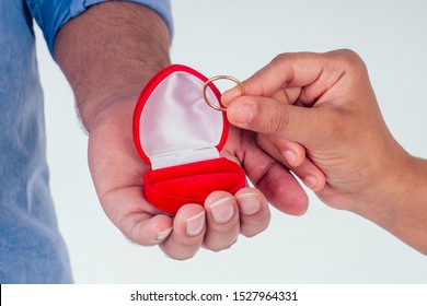 Indian Woman Asking Her Boyfriend To Get Wedding Studio White Background.red Gift Ring Box Heard Shape.