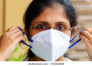 Indian Woman In Close Up View Wearing An N95 Face Mask For Corona Virus Awareness Concept