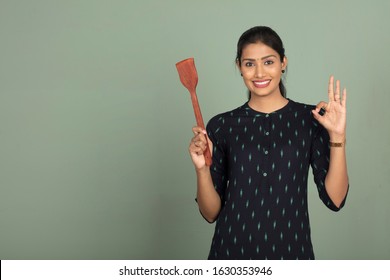 Indian Woman With Cooking Pan, Indoor Shot