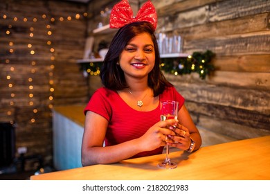 Indian Woman Drinking Alcohol At Studio Shot Spruce Christmas Tree Lights Garland Background